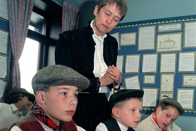 Victorian Day at Manor Road CP School, Clayton-le-Woods, Preston, as teacher Karen Kenyon supervises the work of (from left) Philip Haslam, Adam Barlow and Johnathan Woan