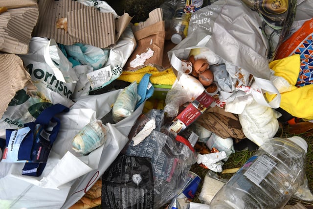 An assortment of dirty nappies, food waste, plastic bags, bottles and more were left strewn across the area.