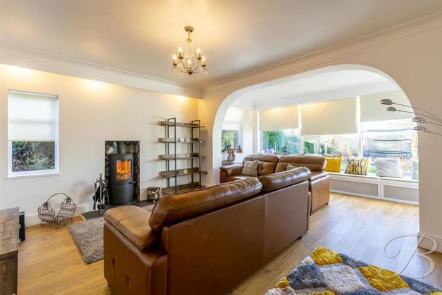 The main focal point of the living room is a feature fireplace housing a multi-fuel burner, which instantly sets the scene for cosy, relaxed nights in.