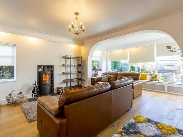 The main focal point of the living room is a feature fireplace housing a multi-fuel burner, which instantly sets the scene for cosy, relaxed nights in.