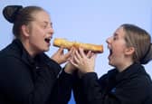 Becky and Carla at Bowens Pies Chorley with one of the giant sausage rolls.
