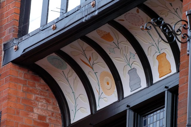 Beautiful paintwork in elaborate window frames at the old Conservative Club, Guildhall Street, Preston