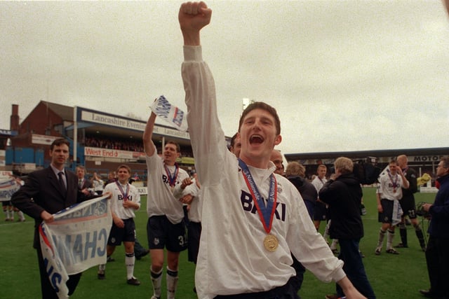 Pictured here Jon Macken leads the celebrations as Preston North End won promotion and were crowned champions of the Second Division. Macken joined the Lilywhites in 1997 and in 189 appearances proved himself to be a prolific goalscorer with 63 goals. He twice won the Player of the Year award