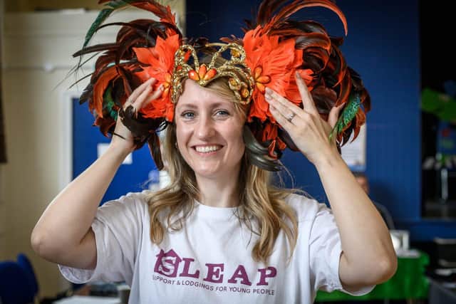 A member of SLEAP trying on a Caribbean headdress. Photo Paul Heyes and Progress Housing Group