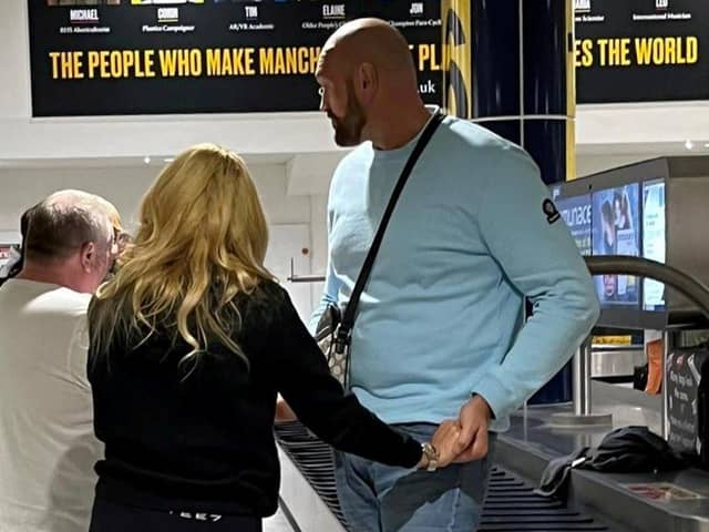 Tyson Fury with wife Paris after landing back in Manchester from their family holiday in Tenerife.