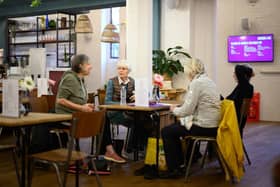 A communal area used as a "warm bank", where people can socialise, work and rest without worrying about heating their homes during the winter months. (Photo by Leon Neal/Getty Images)