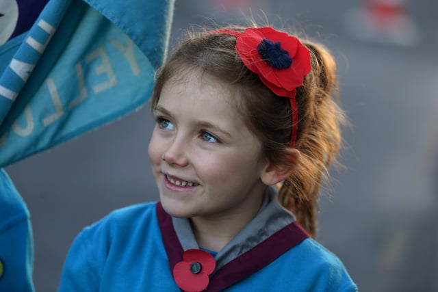 This little girl proudly displays her poppy headband
