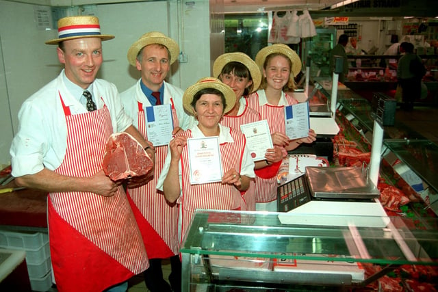 Master Butcher Richard Bamber, with manager, Richard Heague and staff, Olive Brown, Iris Fox and Lucy Cottam on their stall in Preston indoor market
