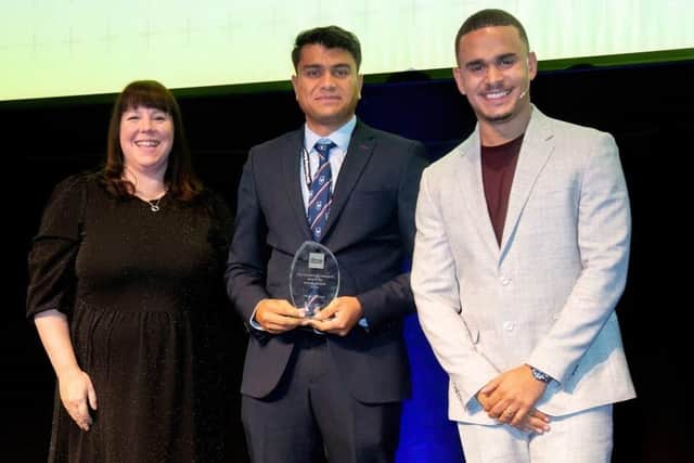 Adnan (centre) is presented with his award by inspirational speaker Ashley John Baptiste and is Anna Butcher, partner and care experience manager at the John Lewis Partnership