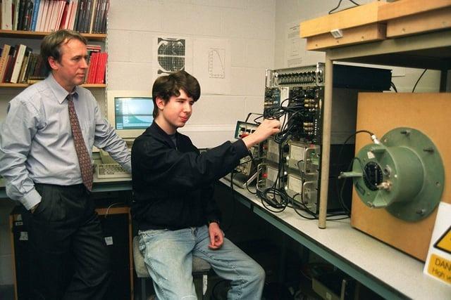Preston College physics teacher Peter Dunne (left), with A-level student David Costich, and the Cosmic Ray Telescope that tests Einstein's Theory of Relativity