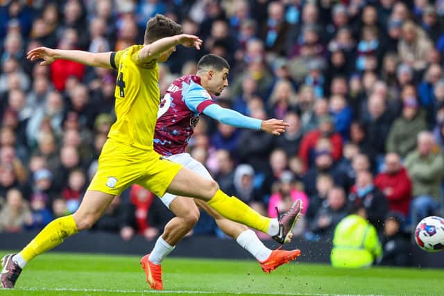 Burnley’s Anass Zaroury shoots under pressure from Preston North End’s Jordan Storey