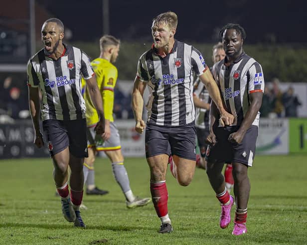 Harvey Smith, centre, celebrates after equalising for Chorley against Alfreton (photo: David Airey/dia_images)