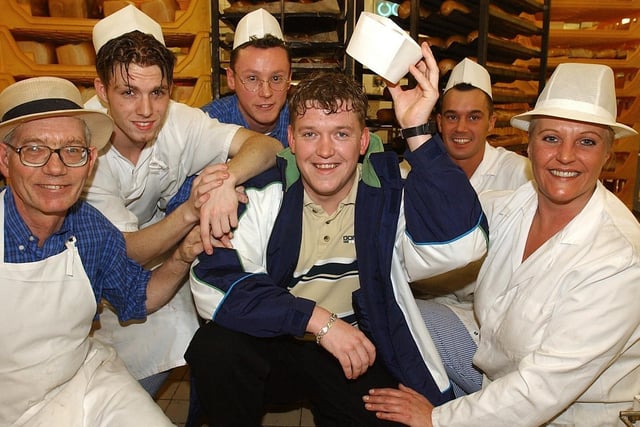 David Russell (centre), a baker at Chorleys Tesco store, picked up a £4,128,013 fortune in February 2002