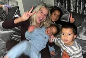 Helen Flangan with her three children in her lounge. Credit: hjgflanagan on Instagram