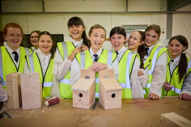 Girls with the bird boxes they made