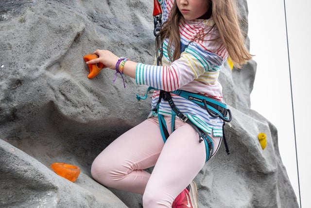Much Hoole Spring Fair. Eloise Wrightside tries the climbing wall.