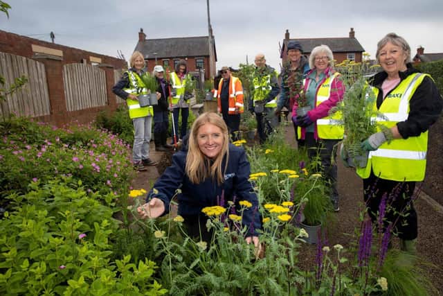 Anwyl’s Imogen Suffell with Catterall in Bloom volunteers at a community garden assisted by the h