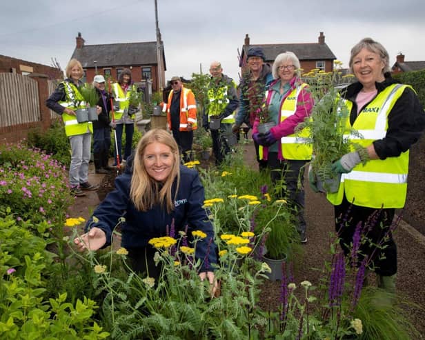 Anwyl’s Imogen Suffell with Catterall in Bloom volunteers at a community garden assisted by the h