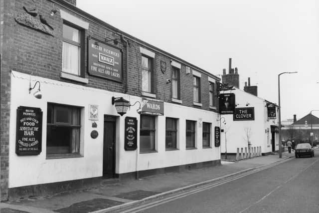 This image shows two pubs - Mister Pickwicks and in the background The Clover