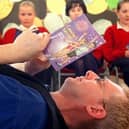 Storyteller Fran O'Boyle works on his book review with (from left) Claudia Fisher-Godwin, Heather Skachill, Marguerite Ralphs and Samantha Bentley from Penwortham Girls High School, near Preston, during book week in 1999