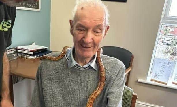 Mike Potts from Critters Interactive in Leyland brought in a selection of interesting animals for the residents in February. Pictured is.Francis McHugh with a snake