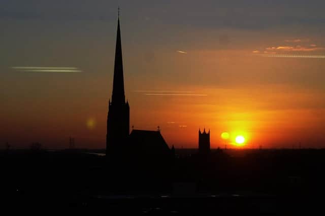 A reason to love Preston - a glorious image of the sun setting on Preston with St Walburg's and St Mark's church silhouetted