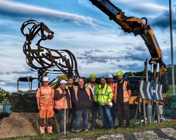 Andy Kay (fourth from left) with workers from G Mackereth and Son and Bravo Power who installed the steel ram at Kirkby Lonsdale