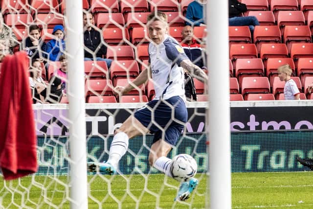 Preston North End striker Emil Riis rolls the ball into the net after taking it round the Barnsley keeper