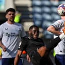 Stoke’s Junior Tchamadeu battles with PNE’s Ryan Ledson (photo: Alex Dodd/CameraSport)
