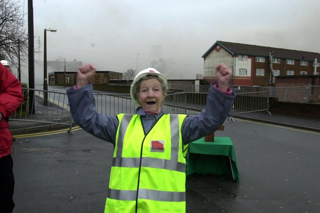 They've gone. Former resident Margaret Slater celebrates the demolition of Moor Lane Flats, Preston. Mrs Slater was chosen to press the detonator on the condemned tower blocks