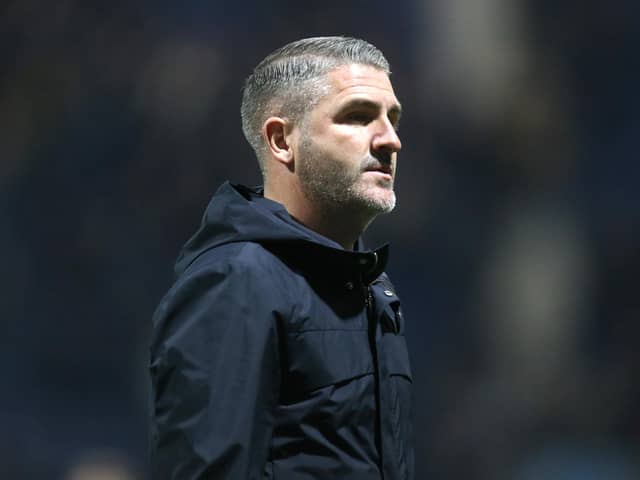 Preston North End manager Ryan Lowe looks on