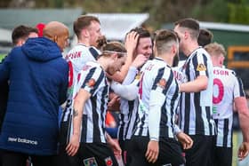 Adam Blakeman, centre, is congratulated after opening the scoring (photo:Stefan Willoughby)