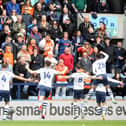 Preston North End players celebrate in front of the Blackpool fans after Brad Potts opened the scoring