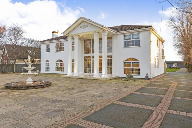 This beautiful house is actually set in five acres of land. It's described as an executive detached family residence and comes with it's own fishing lake, helipad, purpose built offices and wooden log cabin. It's price tag is a whopping £1,200,000 and is on the market with Stephen Tew Estate Agents