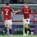 Morecambe's Ben Tollitt celebrates scoring their first goal against Nottingham Forest's U21s with team-mate Luke Hendrie Picture: Lewis Storey/Getty Images