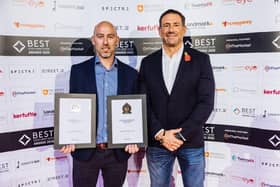Simon Leigh (left) receiving the awards from Jason Fox