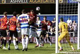 North End's Jordan Storey heads towards goal at QPR