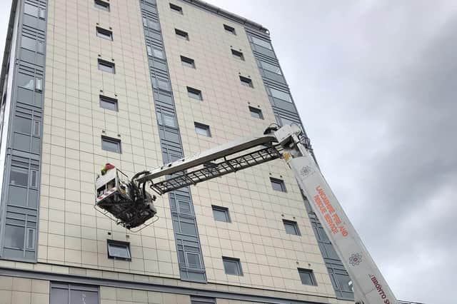 Firefighters used the aerial ladder platform to safely remove four vents from the high-rise building in Cheapside, Preston on Wednesday afternoon (August 23). (Picture by Somewhere in Preston)