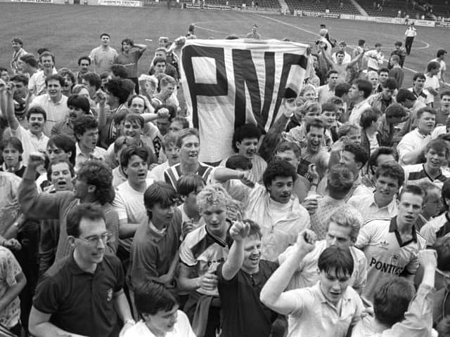 Preston North End fans celebrate on the pitch at Orient's Brisbane Road ground after promotion in April 1987