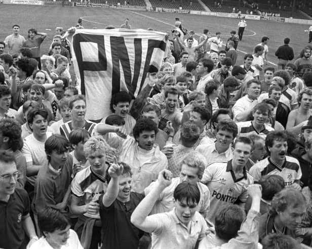 Preston North End fans celebrate on the pitch at Orient's Brisbane Road ground after promotion in April 1987