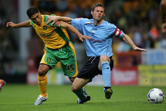 NORWICH, UNITED KINGDOM - AUGUST 08:  Youssef Safri of Norwich tackles Graham Alexander of Preston during the Coca-Cola Championship match between  Norwich City and Preston North End at Carrow Road on August 8, 2006 in Norwich, England.  (Photo by Jamie McDonald/Getty Images)