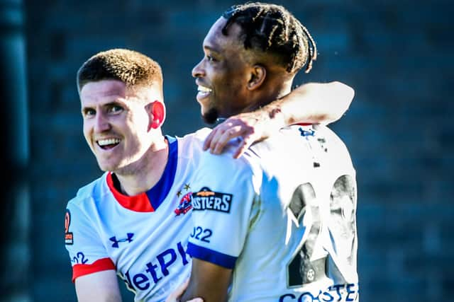 Danny Philliskirk celebrates with Jorome Slew after putting AFC Fylde 3-0 up before half-time against Alfreton