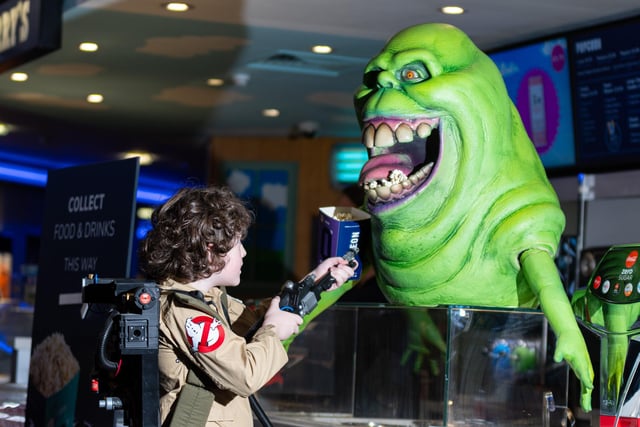 Robin Bell ghost busts Slimer as Preston City Ghostbusters surprised film goers with a surprise visit to Oden Cinema in Preston. Photo: Kelvin Lister-Stuttard