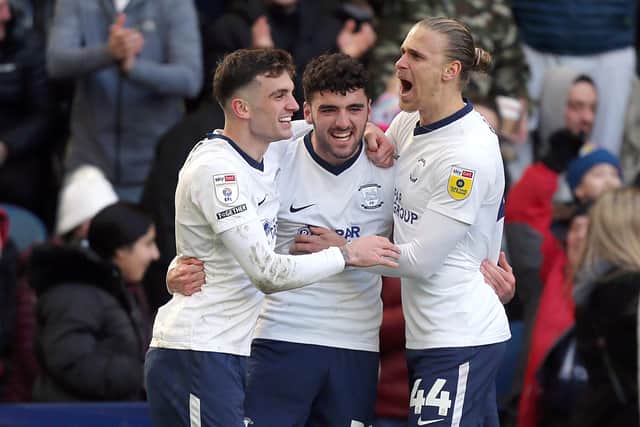 Preston North End's Tom Cannon celebrates with teammates after scoring his side's second goal