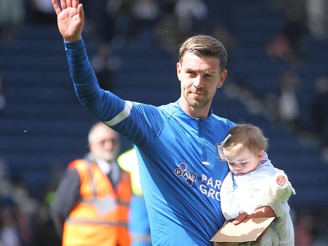 Paul Huntington with his daughter after playing his last game for Preston North End
