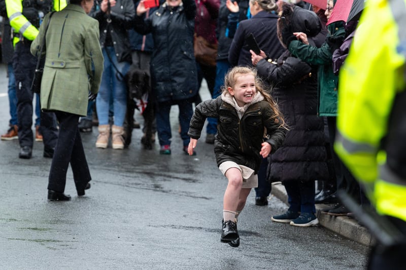 A young girl sprints off in delight after managing to get a cheeky word with Princess Anne. Photo: Kelvin Lister-Stuttard