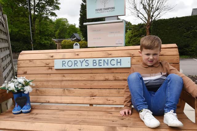 Noah Harty, four, sat on the bench dedicated to his brother Rory