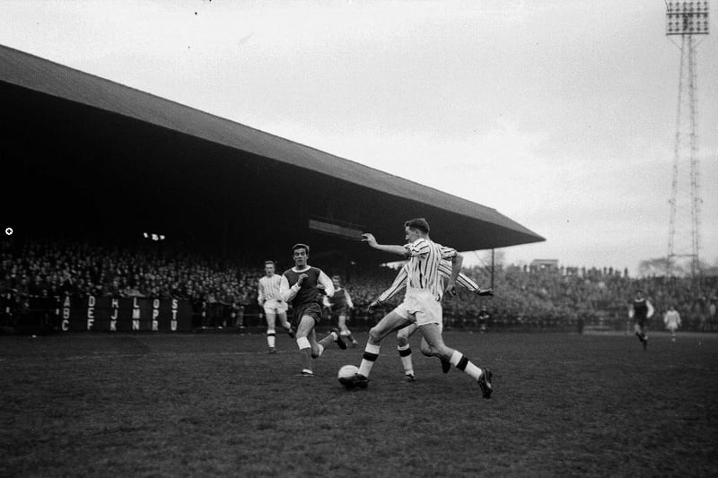 Pat Quinn (in all-green) battles for the ball in a 1-0 defeat at Dunfermline in November 1964