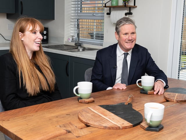 Labour leader Sir Keir Starmer chats with residents, Ryan Barker and Catherine Watkis, inside their newly built home during a visit to a Leyland housing development with Deputy Leader Angela Raynor.  Photo: Kelvin Stuttard