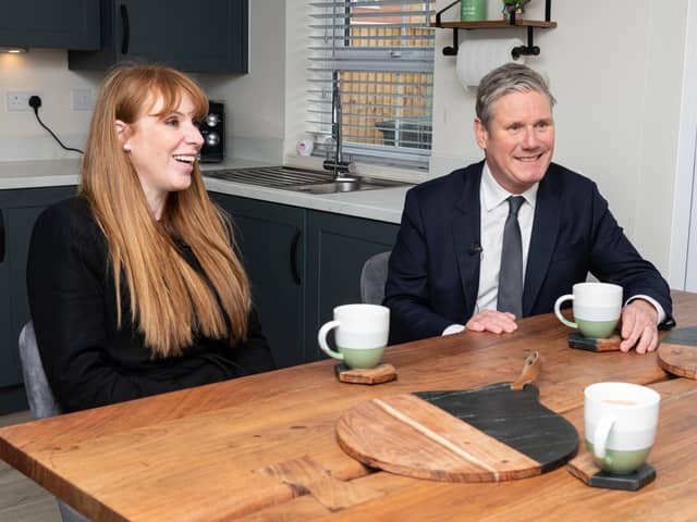 Labour leader Sir Keir Starmer chats with residents, Ryan Barker and Catherine Watkis, inside their newly built home during a visit to a Leyland housing development with Deputy Leader Angela Raynor.  Photo: Kelvin Stuttard